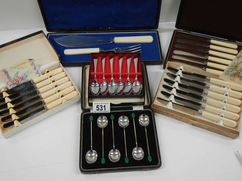 6 assorted cutlery sets including 2 with wedding present cards.