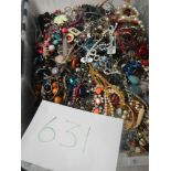 A very large collection of unsorted costume jewellery (crate not included)