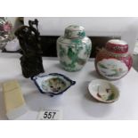 A collection of Japanese and oriental ceramics, a wooden panel, sage figure etc, 7 items in total.