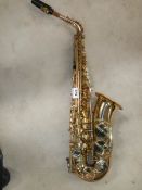 A Thorn Trevor James & Co., alto saxaphone, lacquer worn but otherwise in good condition.