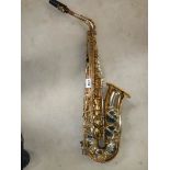 A Thorn Trevor James & Co., alto saxaphone, lacquer worn but otherwise in good condition.