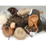 A quantity of dolls wigs.