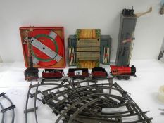 An old key wind train set with track, train in working order.