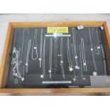 A display case of mainly silver pendants, chains etc., (this lot is buyer collect only).