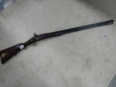 An original percussion rifle in good condition.