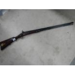 An original percussion rifle in good condition.