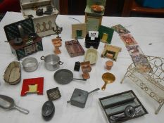 A mixed lot of dolls house items including cooking utensils.