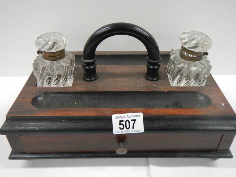 A good early 20th century desk stand with 2 inkwells and single drawer to base.