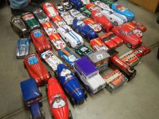 2 boxes of biscuit and sweet vehicle tins including buses and cars.