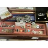 A jewellery box and contents to include pendants, bracelets, rings etc.