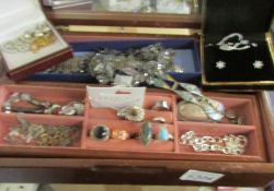 A jewellery box and contents to include pendants, bracelets, rings etc.