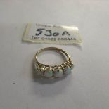 A 9ct gold 5 stone opal ring, size N.
