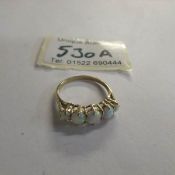 A 9ct gold 5 stone opal ring, size N.