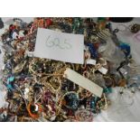 A very large collection of unsorted costume jewellery (crate not included)
