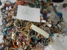 A very large collection of unsorted costume jewellery (crate not included)