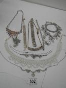 14 items of interesting jewellery including necklaces.