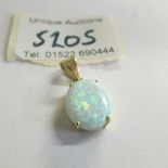 A 14ct yellow gold and opal pendant.