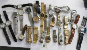 Approximately 25 assorted wrist watches.