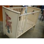 An old painted babies cot.