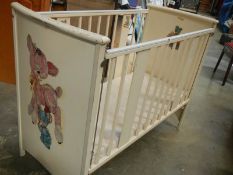 An old painted babies cot.