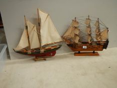 A model sailing ship and a model Man o' war ship.