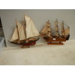 A model sailing ship and a model Man o' war ship.
