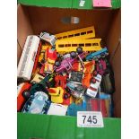 A box containing various die cast toys including Matchbox and Corgi.