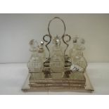 A good silver plate 6 bottle cruet.