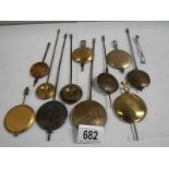 A mixed lot of old clock pendulums.