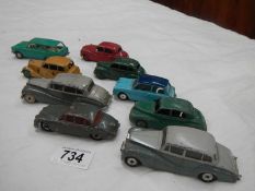 A box containing nine Dinky/Corgi die cast models.