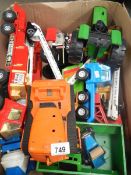 A box of various metal Tonka toys including fire engines.
