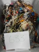 A very large collection of unsorted costume jewellery (crate not included)