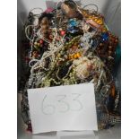 A very large collection of unsorted costume jewellery (crate not included)