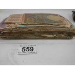 Approximately 120 old bank notes (well used).