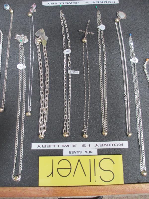 A display case of mainly silver pendants, chains etc., (this lot is buyer collect only). - Image 7 of 10