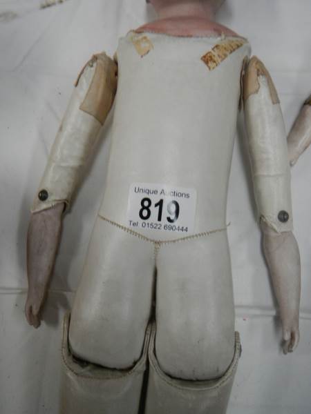 A Victorian porcelain headed doll with kid body, needs wig, 20" tall. - Image 2 of 5