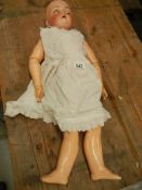 A Victorian porcelain headed doll, missing wig, 27".