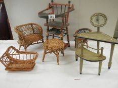 A mixed lot of vintage dolls house furniture including French dressing table and stool.