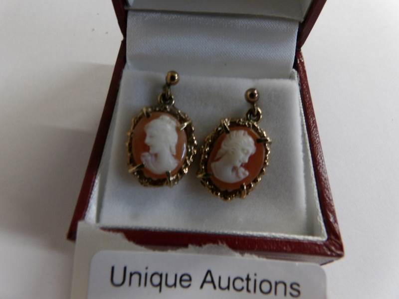 A pair of gold ear pendants set with cameo's of a female profile. - Image 2 of 2