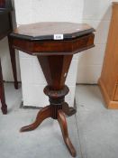 A Victorian sewing table.