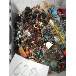A very large collection of unsorted costume jewellery (crate not included)