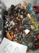 A very large collection of unsorted costume jewellery (crate not included)