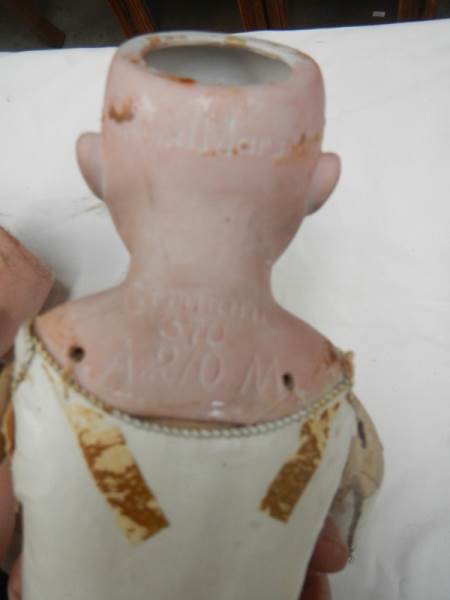 A Victorian porcelain headed doll with kid body, needs wig, 20" tall. - Image 5 of 5