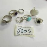 7 assorted silver rings,