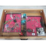 A display case containing miscellaneous badges, jewellery etc., (this lot is buyer collect only).