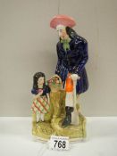 A Victorian Staffordshire figure of a farmer with a young girl.