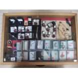 A display case of approximately 40 pieces of mainly silver jewellery including pendants, rings,