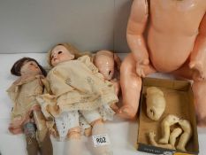 A mixed lot of assorted doll parts.
