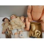 A mixed lot of assorted doll parts.