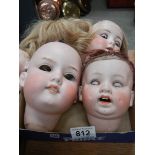 4 large Victorian dolls heads.